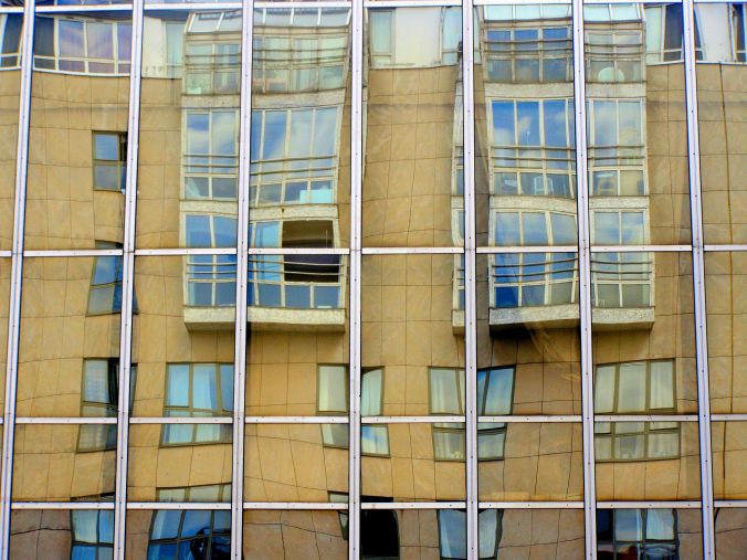 Cloudscape. Mirrored windows reflect the reflections of clouds in the windows opposite as I point my camera upwards in Rue Rambuteau, 75004 Paris.