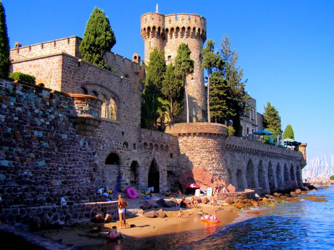 A Very Small But Public Beach. The beach behind the Château De La Napoule in Mandelieu-la-Napoule in the Alpes-Maritimes Department of France. The castle was built in the 14th century by the Countess of Villeneuve. In 1918 it was purchased and restored by American husband and wife, Henry Clews Jr. and Marie Clews. In 1951, in memory of her late husband, Marie Clews founded the La Napoule Art Foundation, a non-profit organization which houses the Clews Collection and hosts international programs in the arts. https://witness.theguardian.com/assignment/55afb147e4b0571ff3516306/1652711